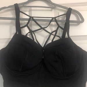 Torrid black swim top with underwire and lattice straps across chest.  Size 3R